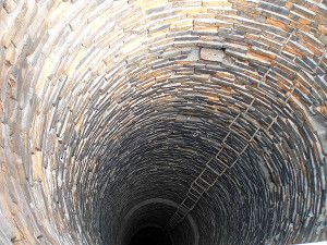 inner surface of an industrial masonry pipe with brackets for the movement of workers